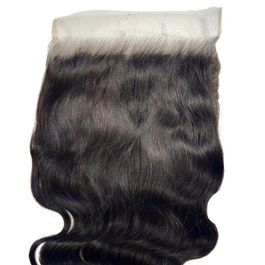 Close-up of the Body Wave 7x7 HD Lace Closure from LUSSOBYSB showcasing its soft and wavy texture, made from 100% human hair.